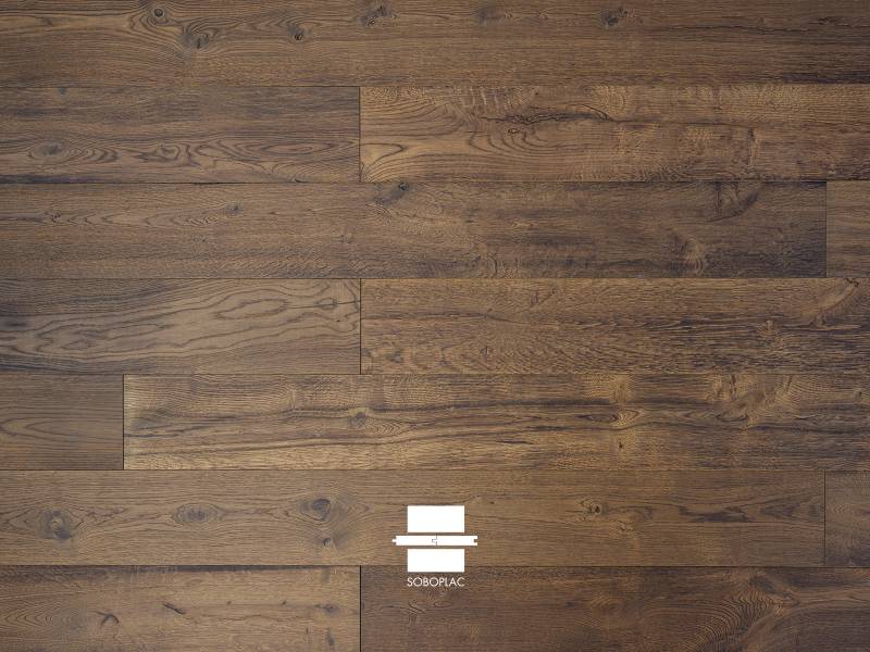 la profondeur d'un chêne brossé et huilé brun. Une chaleur intense pour votre intérieur. Disponible chez nos revendeurs en Savoie